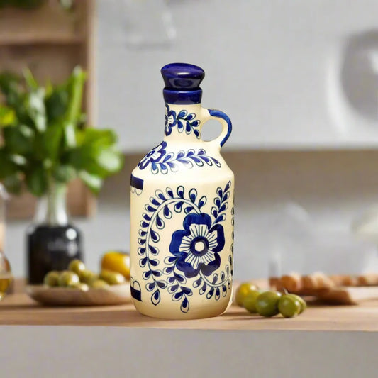 Decorative ceramic bottle with blue floral patterns on a kitchen counter.